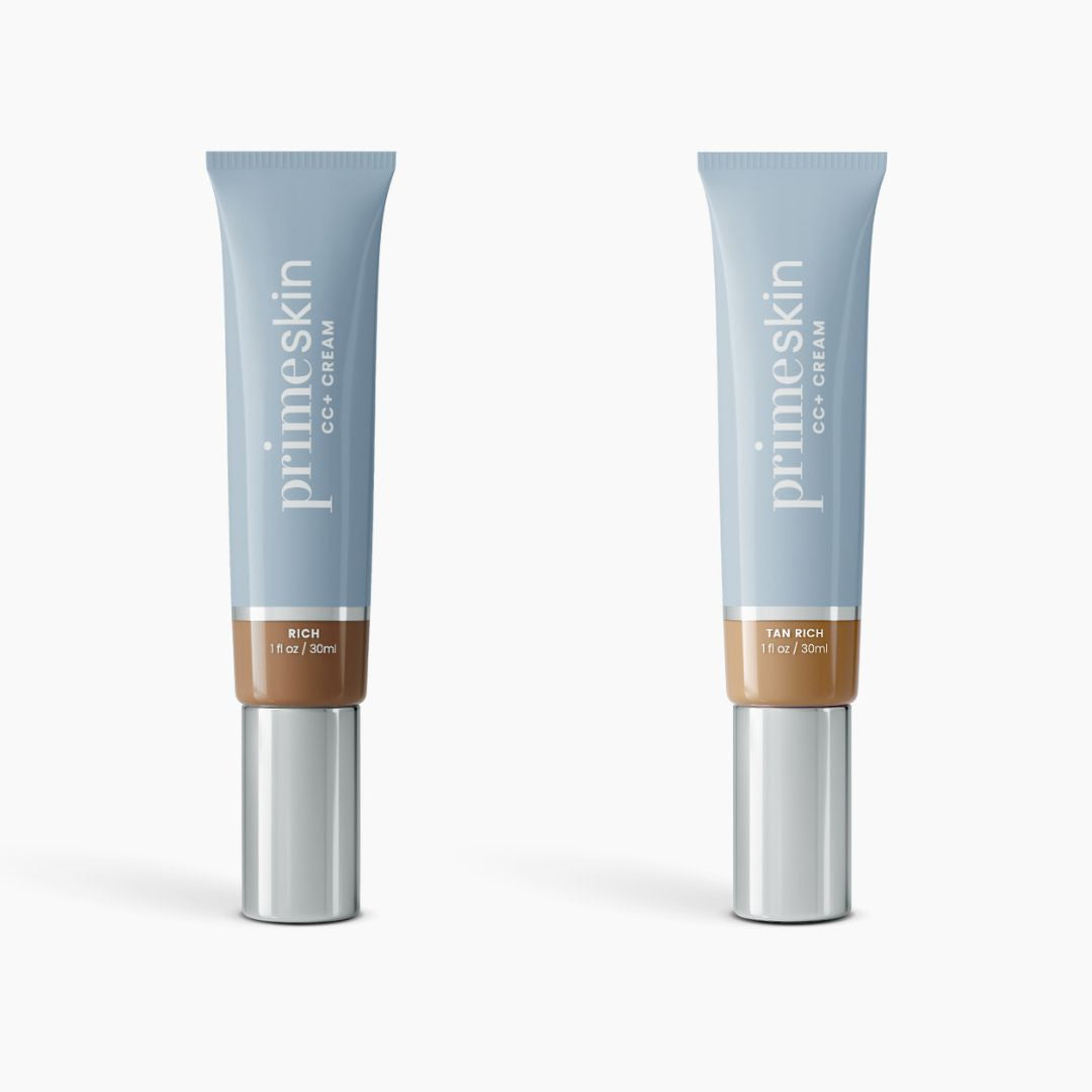 Two tubes of PrimePrometics™ 2pcs PrimeSkin CC+ Cream (1 fl oz/30 ml each) are displayed upright on a white background; the left tube is labeled Rich, the right is Tan Rich. This lightweight foundation helps blur pores.