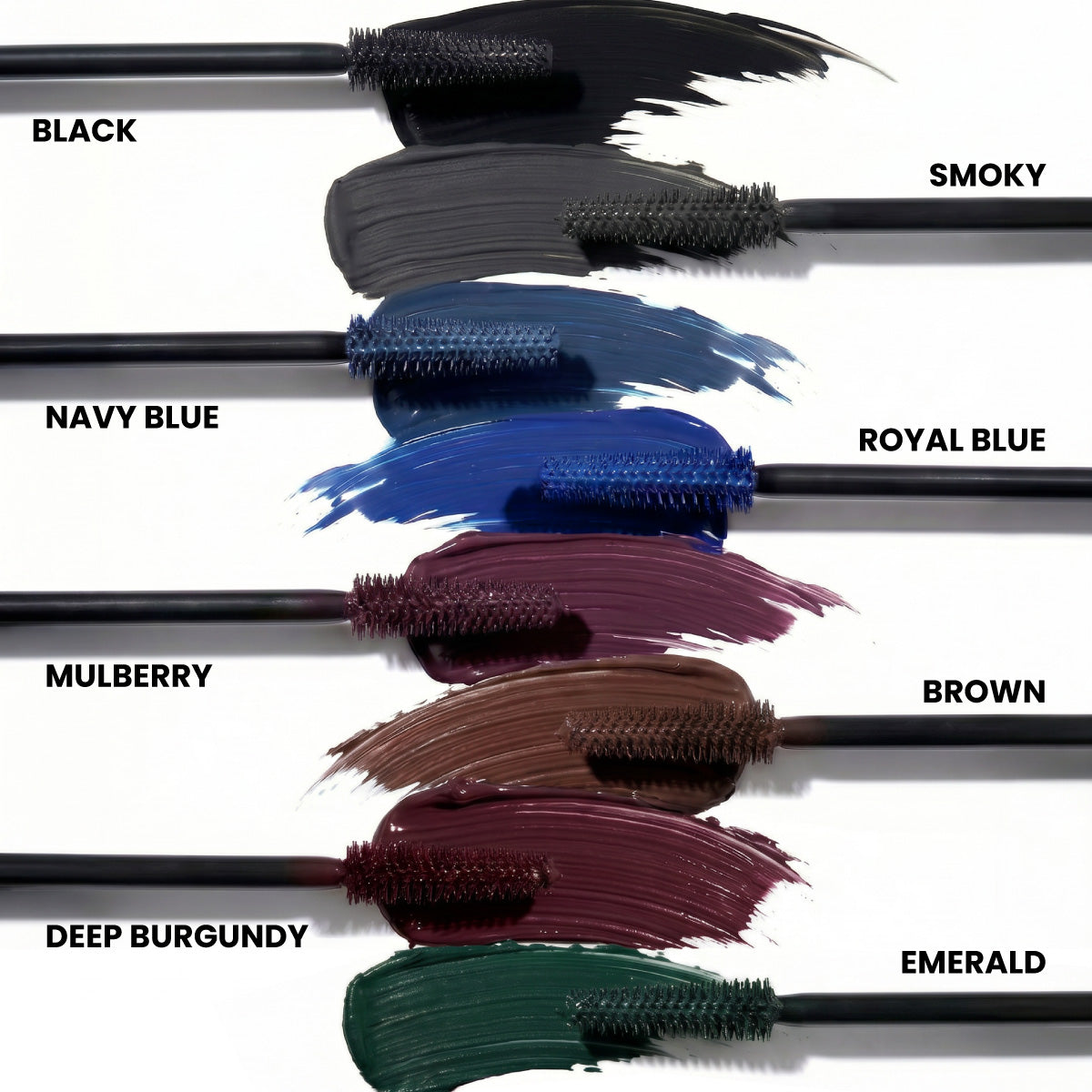 Six PrimePrometics™ PrimeLash Mascara brushes display swipes of vibrant color—Black, Navy Blue, Mulberry, Deep Burgundy, Smoky, Royal Blue, Brown, and Emerald—each clearly labeled by name. Specially created as a pro-age mascara for mature women to enhance natural lash growth while delivering standout color. Background is white.