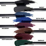 Six PrimePrometics™ PrimeLash Mascara brushes display swipes of vibrant color—Black, Navy Blue, Mulberry, Deep Burgundy, Smoky, Royal Blue, Brown, and Emerald—each clearly labeled by name. Specially created as a pro-age mascara for mature women to enhance natural lash growth while delivering standout color. Background is white.