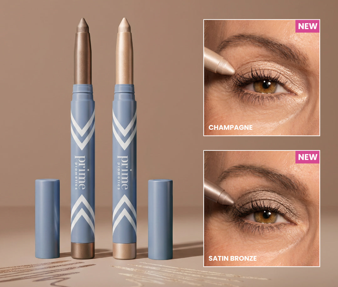 Two blue makeup sticks with beige and champagne tips stand upright. Beside them, close-up images show a person applying Champagne and Satin Bronze eye shadow sticks to their eyelids. Both shades are labeled as new.