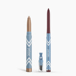 PrimePrometics™ Eye Lift Duo: two blue-and-white water-resistant makeup pencils (one gold, one dark red) stand upright beside a clear sharpener container. Perfect eyeliner for women over 50, labeled "prime," shown on a white background.