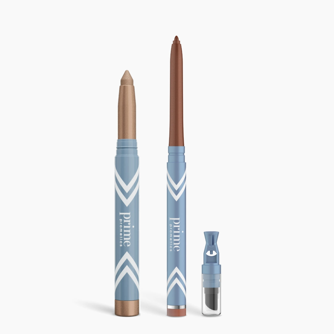 Three PrimePrometics™ Eye Lift Duo products in blue and white packaging—a chubby stick, a slim eyeliner for women over 50, and an illuminating eye tint vial—stand upright on a white background.