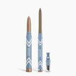 Three blue and copper PrimePrometics™ Eye Lift Duo makeup products—a thick eyeshadow stick, a slim eyeliner for women over 50, and a small clear powder container—are shown on a white background.