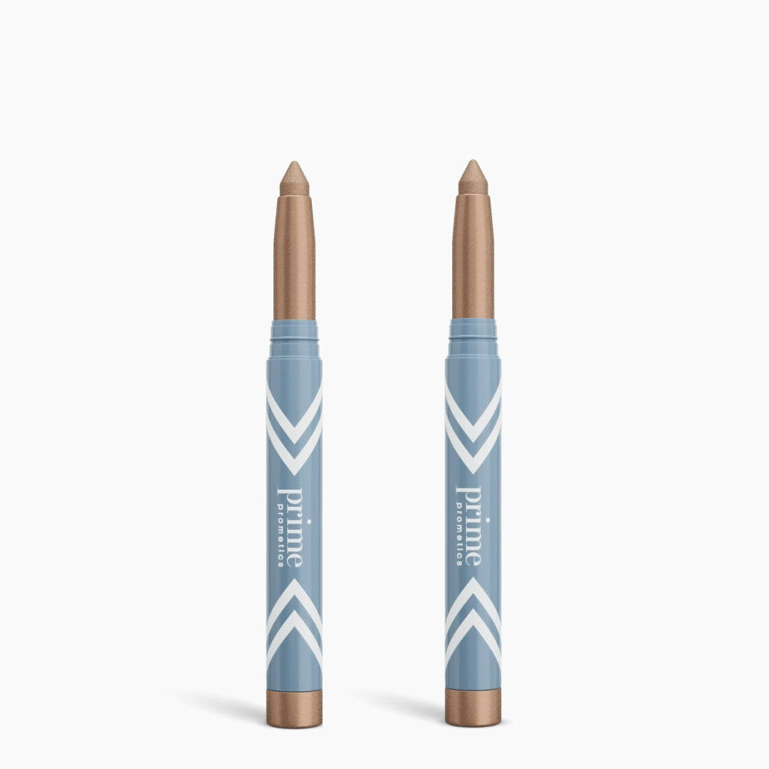 Two PrimePrometics™ 2pcs PrimeEyes Eye Brightener sticks stand upright in blue and white tubes labeled "prime promenade" against a white background, perfect for adding a dazzling metallic gold touch to your eyes.