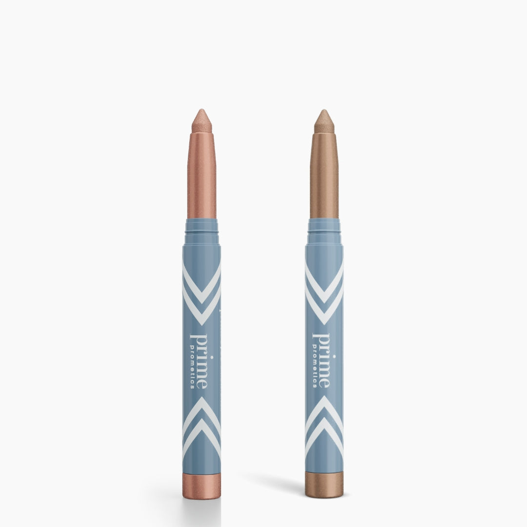 Two blue PrimePrometics™ 2pcs PrimeEyes Eye Brightener sticks with white stripes and metallic ends stand upright, one with a rose gold tip, the other bronze—ideal for brightening eyes.