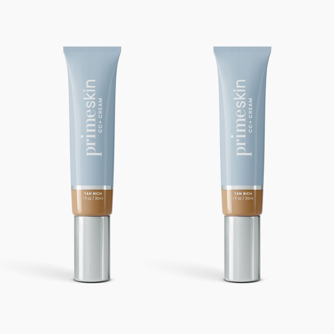 Two tubes of PrimePrometics™ 2pcs PrimeSkin CC+ Cream (1 fl oz/30 ml each, shade Tan Rich) stand upright on a white background. This foundation blurs pores for a flawless finish, ideal for women over 50.