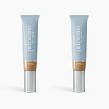 Two tubes of PrimePrometics™ 2pcs PrimeSkin CC+ Cream (1 fl oz/30 ml each, shade Tan Rich) stand upright on a white background. This foundation blurs pores for a flawless finish, ideal for women over 50.