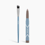 A blue Seamless Shadow Bundle Matte brush with a silver ferrule and black-and-white bristles lies beside a blue PrimePrometics™ matte eyeshadow stick with a brown tip, both labeled on a white background.
