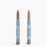 Two blue PrimePrometics™ Complete Eye Sticks Kit—one with a taupe tip, one with a shimmery bronze—stand upright on white, ideal for matte eyeshadow looks or an eye-brightening effect.