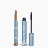 Two blue makeup products: an opened Iconic Matte Eye Kit brow pencil with a brown tip on the left and an opened tube of mascara with its wand on the right. Both are labeled PrimePrometics™ with silver and white accents.