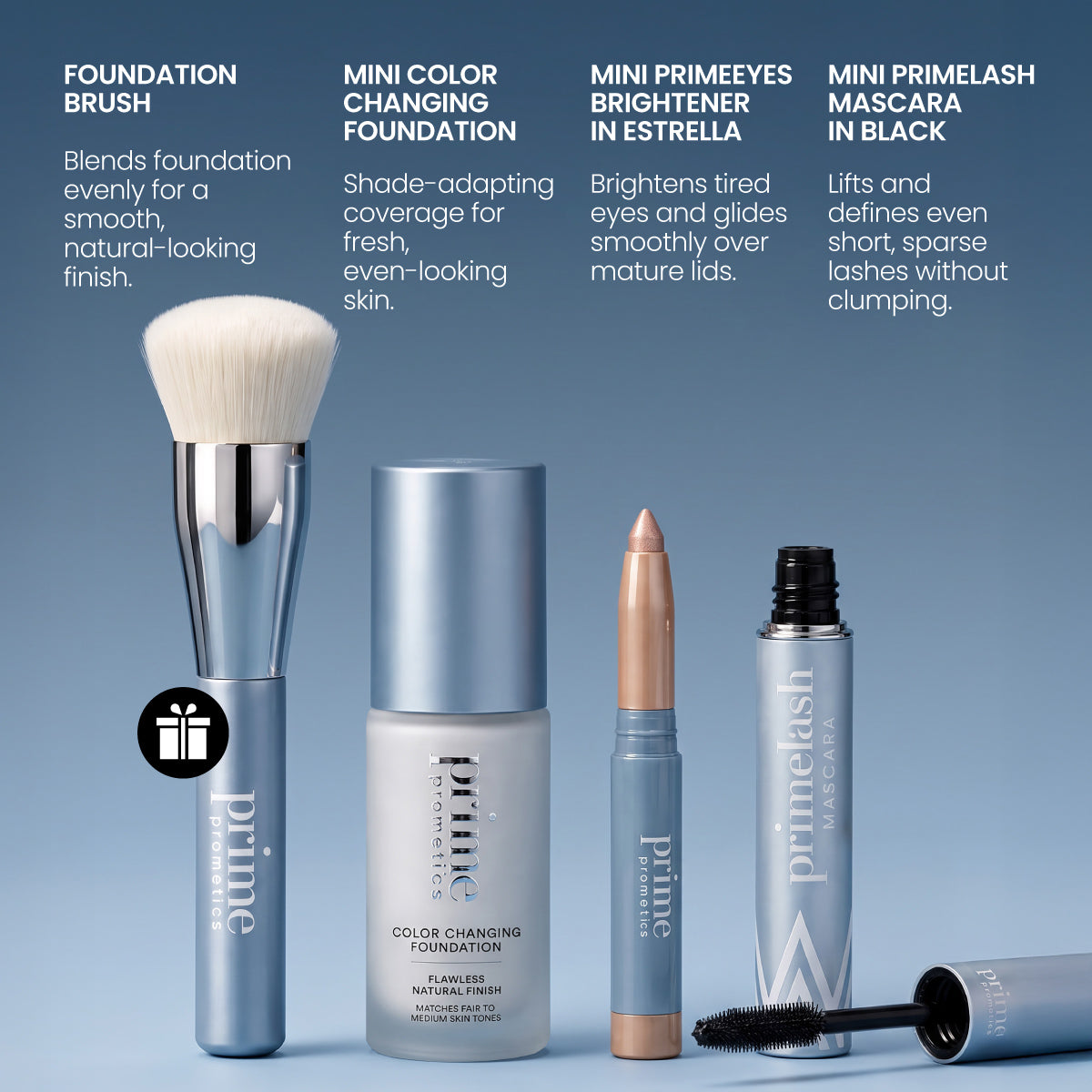 Four PrimePrometics™ Prime Mini Essentials Travel Kit products are displayed on a blue background: a foundation brush, a bottle of mini foundation, a Prime Eyes Brightener Stick, and a tube of black mascara—beauty essentials perfect for your travel makeup kit—with brief descriptions above.