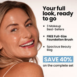 A smiling woman with glossy lips stands next to text promoting the Prime Mini Essentials Travel Kit by PrimePrometics™: featuring 3 best-sellers, a free foundation brush, a spacious beauty bag, and a 40% discount on the complete set—your must-have travel makeup kit packed with essentials and a mini foundation for flawless looks wherever you go.