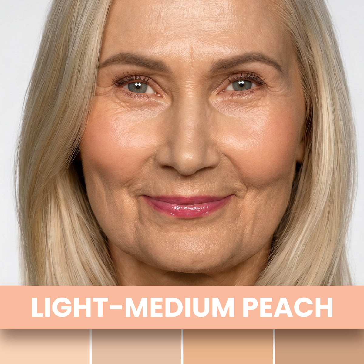 A smiling older woman with light blonde hair and peach makeup wears PrimePrometics™ Undereye Brightening Corrector in Light-Medium Peach, shown above four light peach swatches—ideal for disguising dark circles.