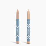 Two blue Complete Eye Sticks Kit by PrimePrometics™ stand upright on a white background. One has its beige cap on; the other reveals a light nude shade, ideal as an Eye Brightener or Matte Eyeshadow. Both feature prime PROMISE labels.