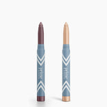 Two PrimePrometics™ 2pcs PrimeEyes Eye Brightener crayons stand upright on a white background; one has a mauve tip and the other a shimmery champagne tip, both in blue chevron-patterned tubes.